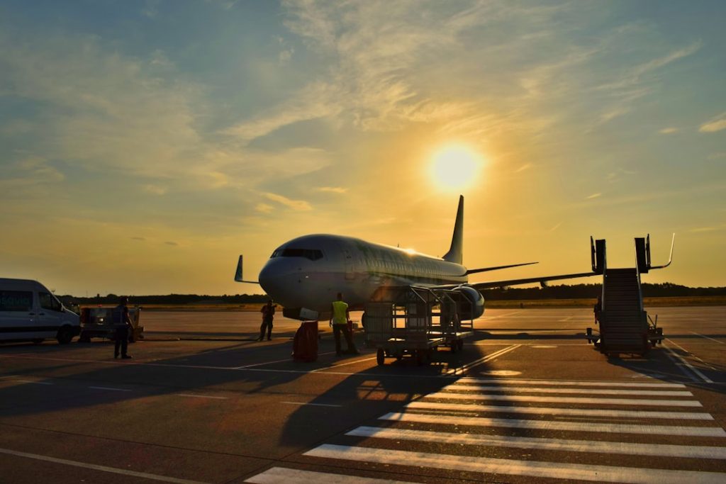 white-airplane-parked-during-daytime-eztgfkfedmm