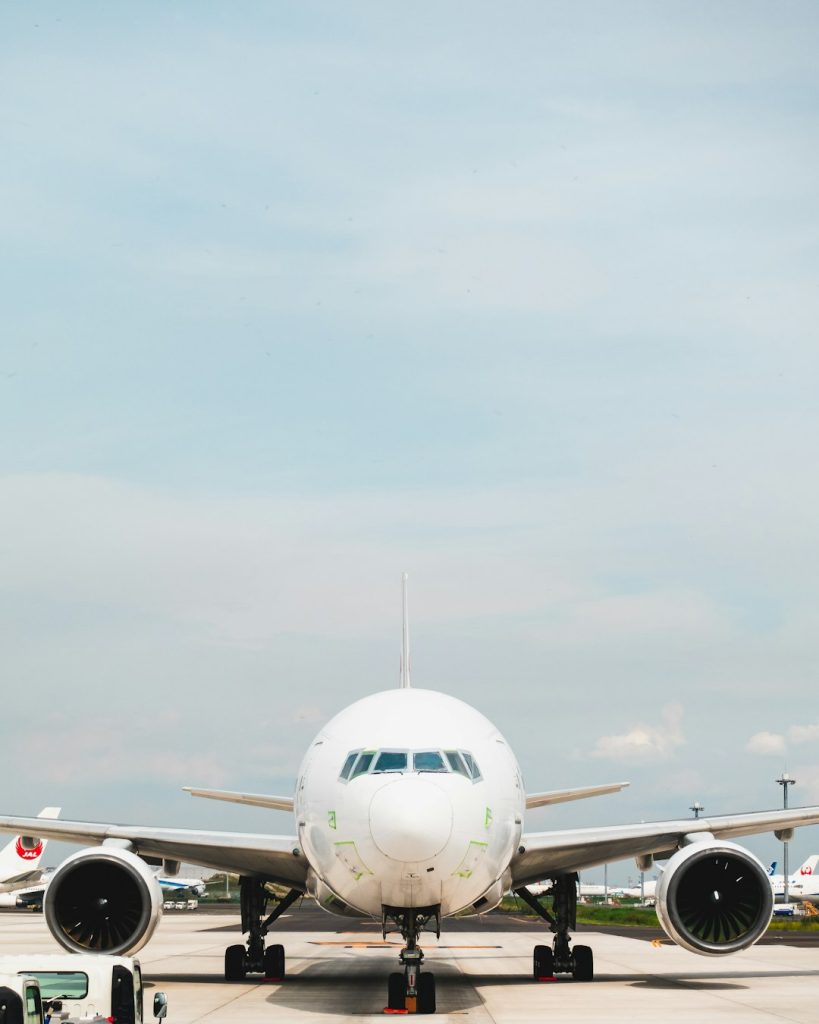 white-passenger-plane-on-airport-during-daytime-aw0n2ailn5a